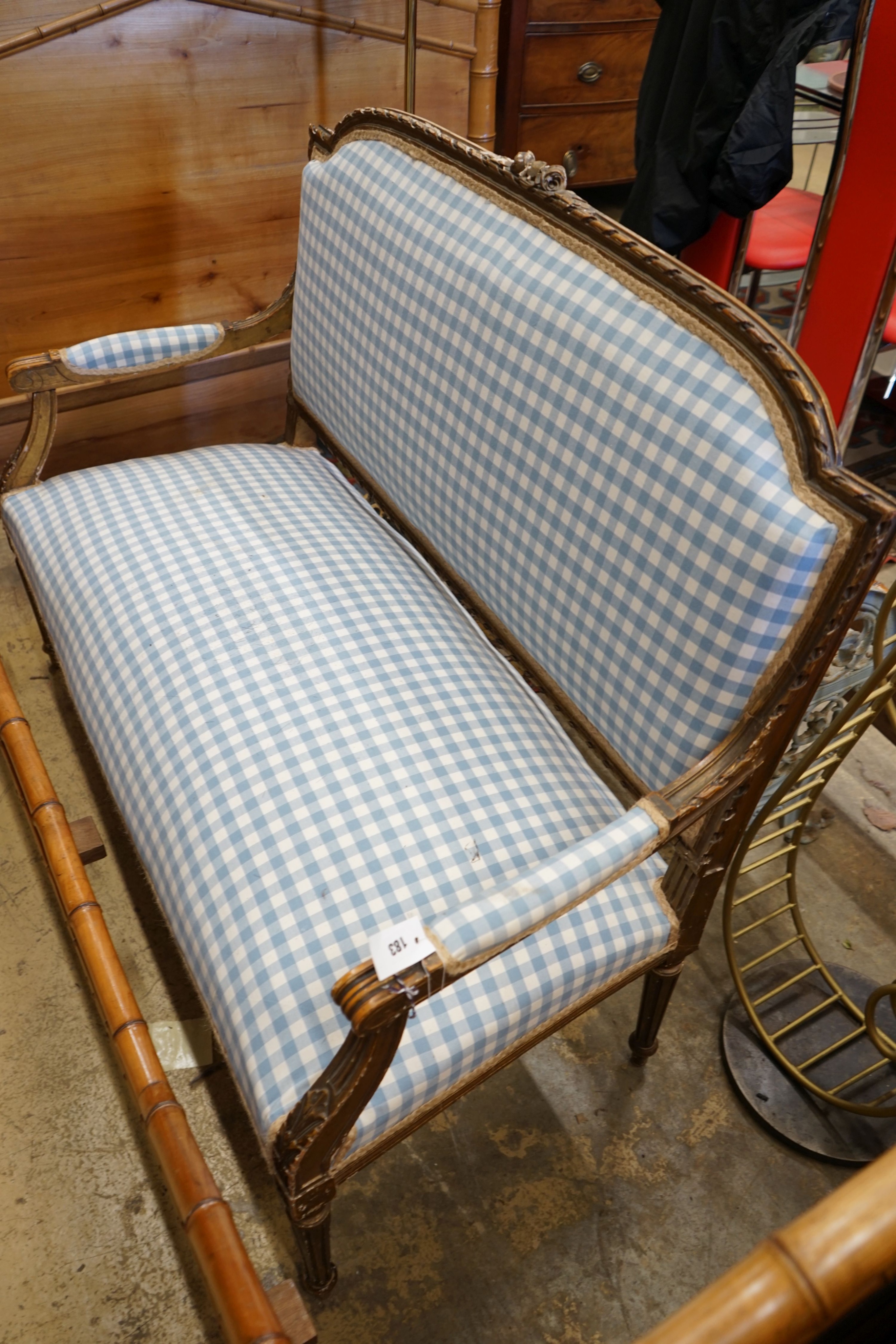 A 19th century French carved giltwood settee recently re-upholstered in blue gingham fabric, width - Image 2 of 2