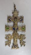 A brass stained glass crucifix inscribed ‘INRI’ with swivel movement - 18cm high