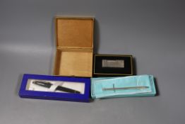 A Tiffany & C pen, a Waterman pen, a Dunhill lighter and a Gucci box