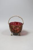A Victorian pierced silver sugar basket, with cranberry glass liner, Birmingham, 1856, diameter 12.