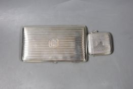 A George V engine turned silver cigarette case, 15cm, and a silver vesta case, gross 8oz.