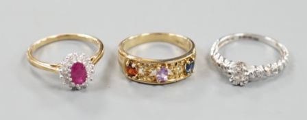 Three assorted modern 9ct gold and gem set dress rings, gross weight 8.6 grams.