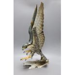 A large Hutschenreuther porcelain Peregrine falcon, 59cm