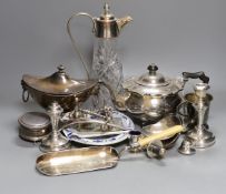 Assorted plated ware including a claret jug, teapot, sauce tureen, a pair of silver mounted dwarf