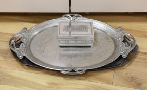 An Edwardian oval Art Nouveau metal tray, a similar oak and pewter tray and a WMF box,pewter tray 58