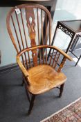 A Victorian elm and beech Windsor armchair, with fruit wood splat, width 56cm depth 40cm height
