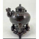 An unusual Chinese black ware tenmoku glazed tripod wine pot, 19th/20th century, with camel head