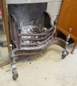A Victorian brass mounted cast iron serpentine fire grate, width 80cm, depth 46cm, height 72cm