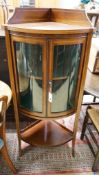 An Edwardian inlaid mahogany bow fronted standing corner cupboard, width 60cm, depth 44cm, height