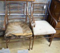 A pair of wrought iron designer chairs