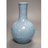 A Chinese blue-glazed moulded bottle vase - 23cm high