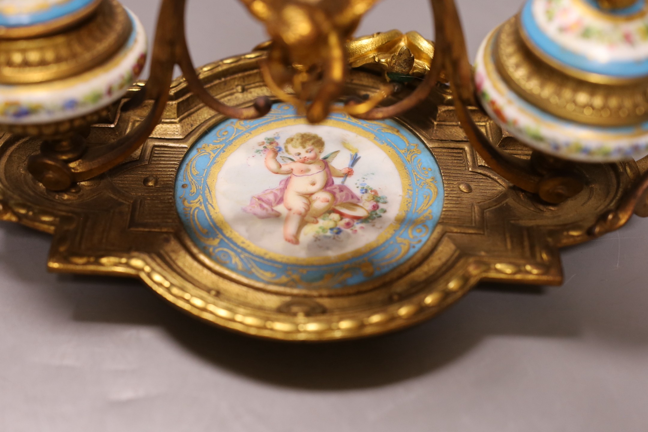 A late 19th century ormolu and 'Sevres' inkstand with cherub and floral decoration - 29cm long - Image 2 of 2