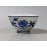 A Chinese blue and white circular bowl, inscription to base - 5cm tall