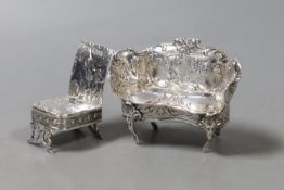 An Edwardian silver miniature model of a two seater settee, import marks for Elly Isaac Miller,