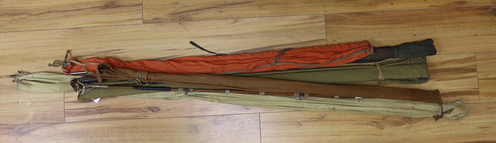 A quantity of fishing rods in fabric sleeves (6)