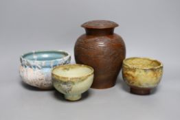 Two Japanese stoneware tea bowls (chawan), a Japanese raku bowl and a Japanese carved wood tea