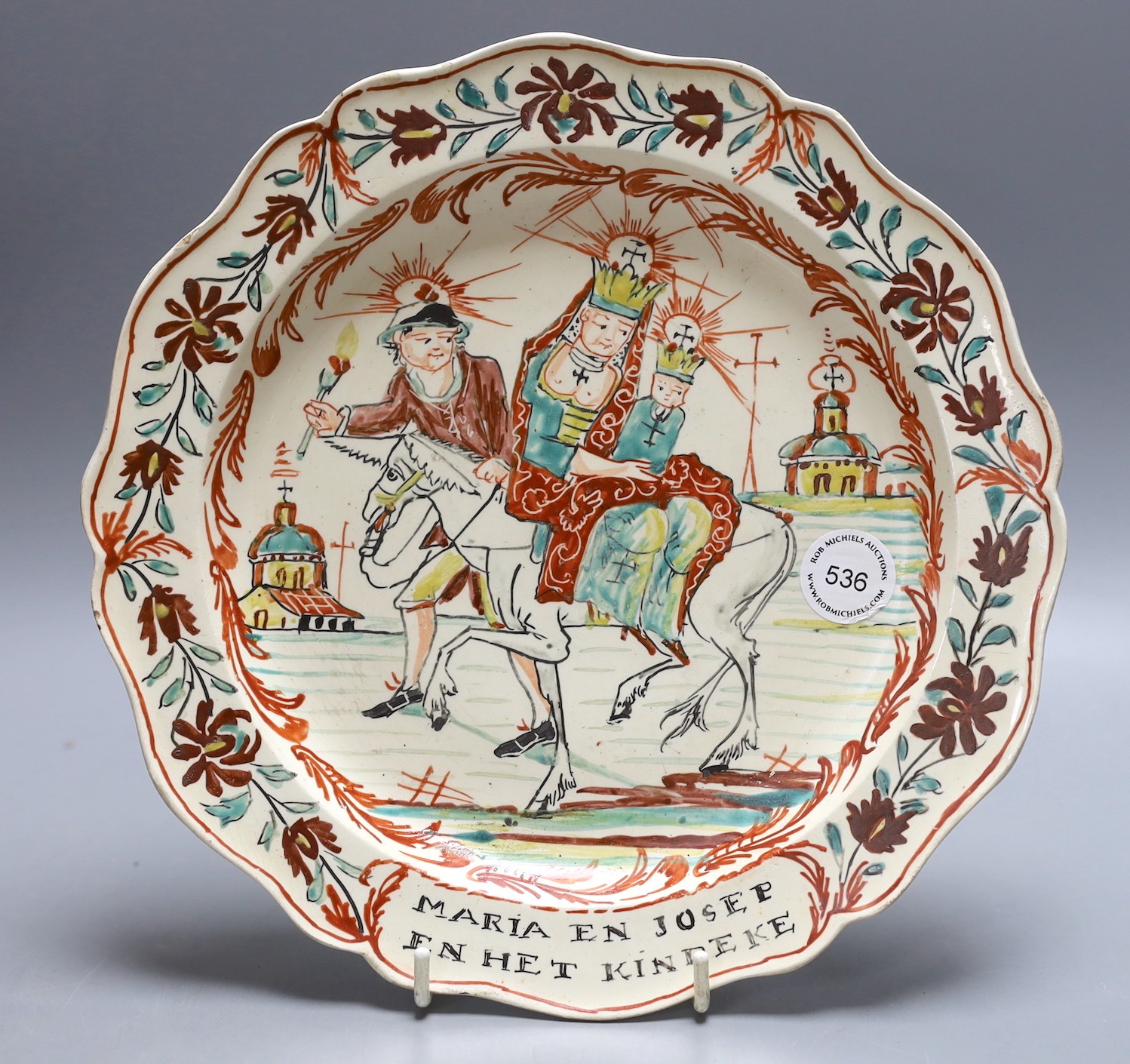 A Dutch decorated Leeds creamware plate, 'Joseph, Mary and the infant, Christ' (Flight into