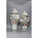 Two Chinese famille rose vases and covers, tallest 46cm high