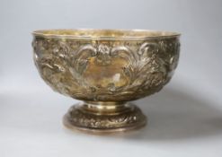 A late Victorian embossed silver rose bowl, decorated with birds amid scrolls, Carrington & Co,