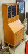 An Edwardian satinwood bureau bookcase, width 69cm, depth 47cm, height 160cm (lock a.f)
