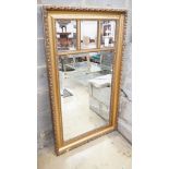 An early 20th century rectangular gilt frame four plate wall mirror, width 78cm, height 137cm