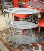 A three tier chrome and glass service trolley, width 65cm depth 27cm height 93cm