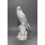 A Dresden white porcelain falcon, 43cm