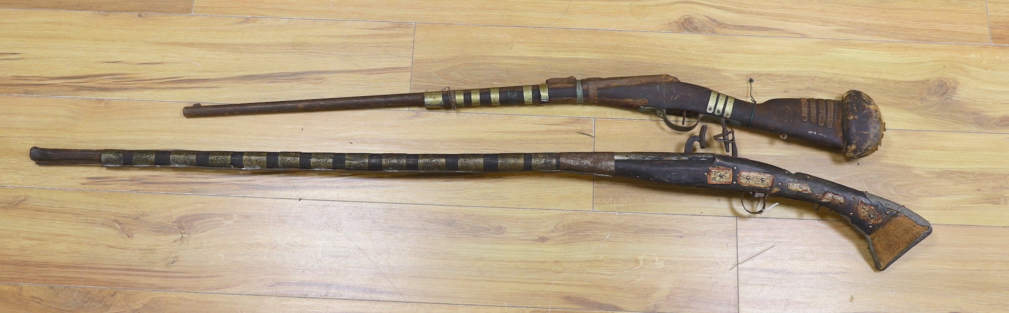 Two 18th century continental long arm rifles,longest 143 cms.
