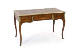 An early 20th century Louis XVI style ormolu mounted marquetry bureau plat, with brown leather