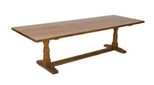An oak 'Mouseman' refectory table by Robert Thompson of Kilburn with adzed rectangular top and