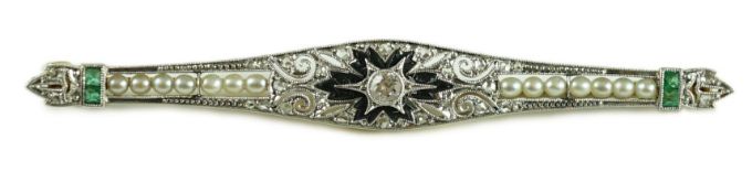 A 1920's gold and platinum, emerald, seed pearl, diamond and black onyx set bar brooch, in a