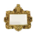 A mid 19th century Florentine ornately carved giltwood wall mirror, of rectangular cartouche form