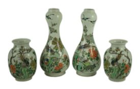 A garniture of four Chinese famille verte vases, 19th century, each painted with pheasants amid