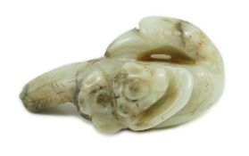 A Chinese white and black jade figure of a preening duck, Ming dynasty, carved in relief with a