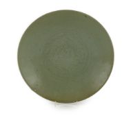 A Chinese celadon glazed sgraffito dish, Zhangzhou kilns, late 16th/early 17th century, incised with
