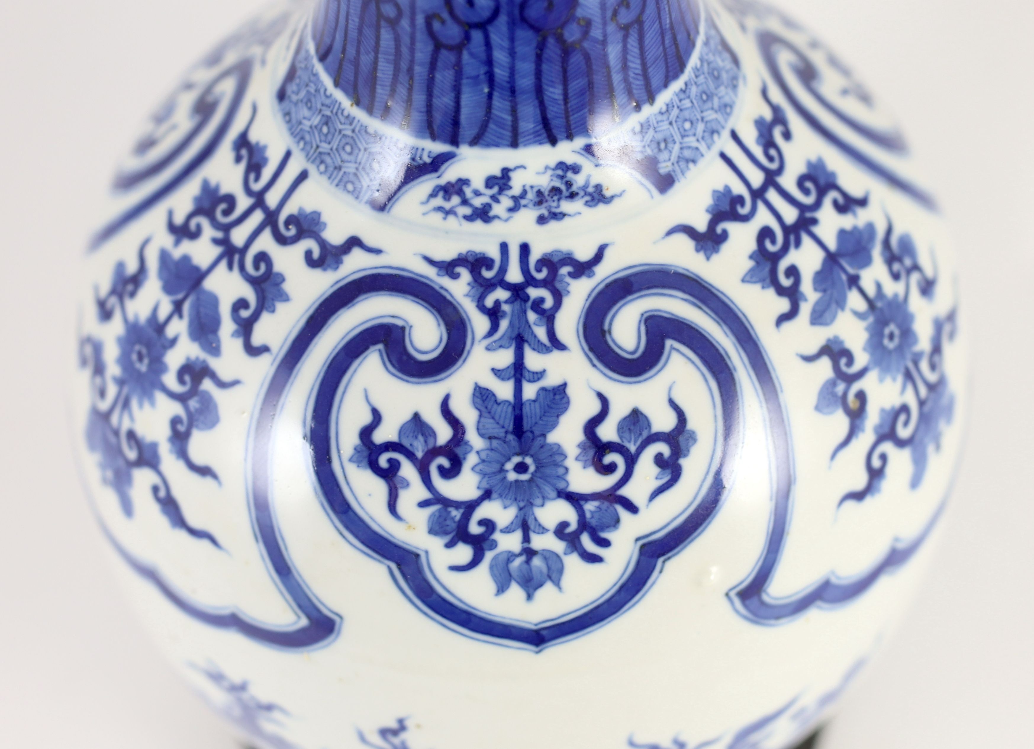 A large Chinese blue and white bottle vase, 19th century, painted with leaf and flower sprays and - Image 4 of 5