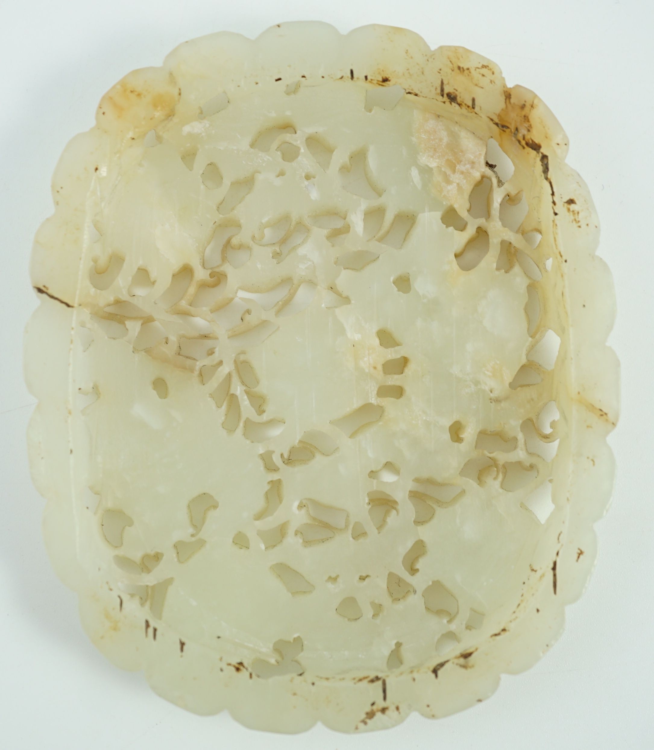 A Chinese pale celadon jade oval openwork plaque, 19th century, probably taken from a ruyi - Image 8 of 10