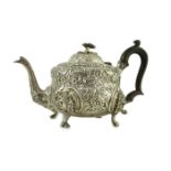 An early Victorian embossed silver teapot, by William Moulson, with engraved crest with coronet