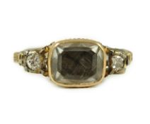 An 18th century gold and rock crystal and diamond set mourning ring, with plaited hair beneath the