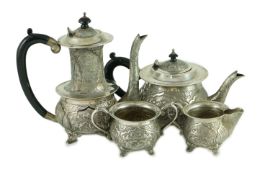 A 20th century Indian four piece silver tea and coffee service, embossed with animals in landscape