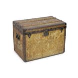 An early 20th century Louis Vuitton iron bound travelling trunk, with yellow LV fabric covering