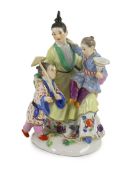 A Meissen group of a Chinese woman and two children, 20th century, blue crossed swords mark and