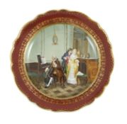 A Meissen outside decorated dish, 19th century, painted with a courting couple in a music salon,