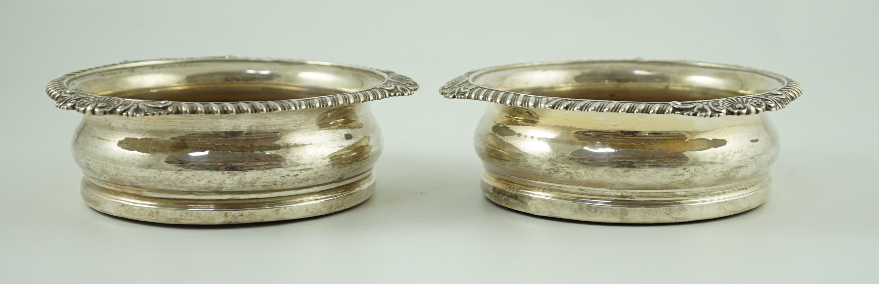A pair of George IV silver wine coasters by Benjamin Smith III, with gadrooned and shell border, the - Image 5 of 11