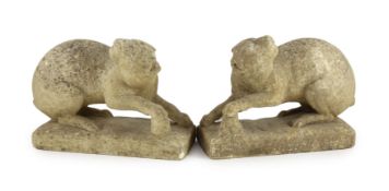 A pair of 19th century carved marble models of crouching cats, width 32cm, depth 12cm, height