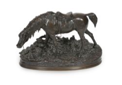 Pierre Jules Mène (French, 1810-1879). A bronze group of a saddled horse standing upon a mound