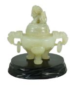A Chinese pale celadon jade tripod censer cover, 20th century, 12cm wide, wood standOccasional