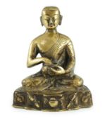 A Himalayan bronze figure of Buddha, 19th century, the seated figure holding an alms bowl, the
