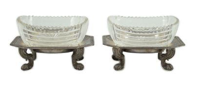 A pair of George V silver salt cellars, with cut glass liners, of octagonal form, with Greek key