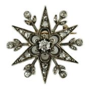 A Victorian gold, silver and diamond set starburst brooch, 30mm, gross weight 6.7 grams.Visible lead